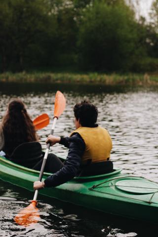 green kayak on open waters